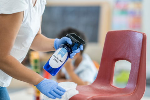 Sanitizing daycare chairs with child-safe cleaning products